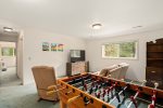 Upper level living area has a lot of fun to offer from foosball to books
